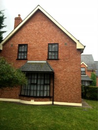 Dublin home painting - window frame painting, eaves and base of house painted by Abhaile Decorators, Robert Hanvey, Ireland