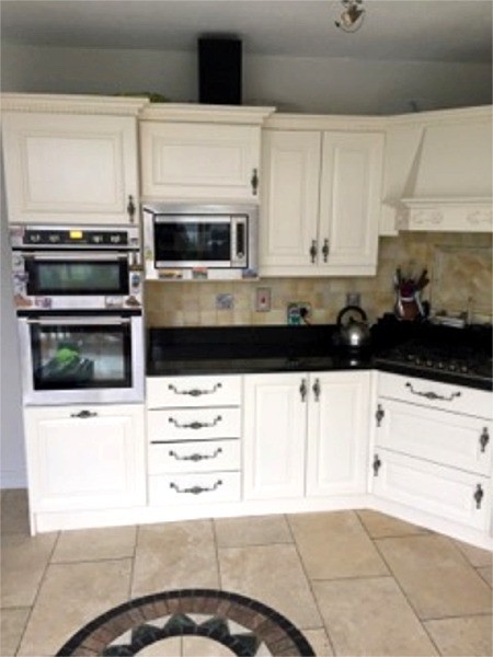 Hand painting kitchen cupboards cream - Quality home decoration by Abhaile Decorators, Ireland